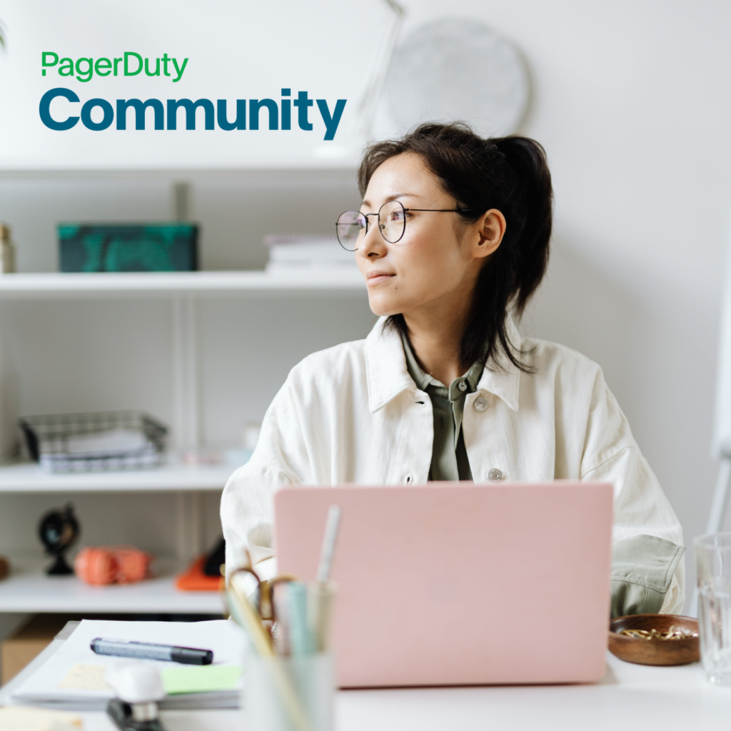 Woman working in a computer, symbolizing active participation in the PagerDuty Community. The PagerDuty Community logo is displayed.