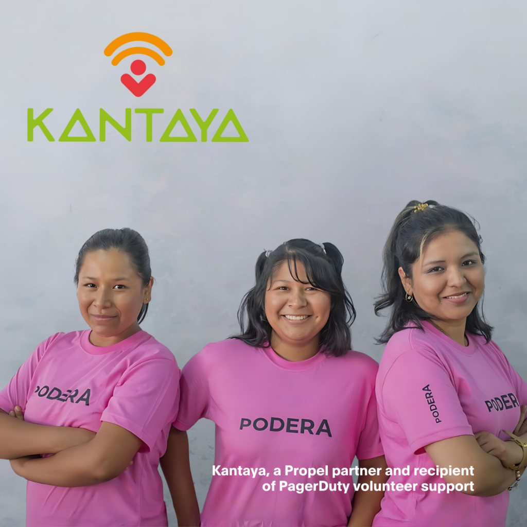 Three women from Kantaya, a Peruvian nonprofit, wearing pink shirts with the words “Podera” written across their chest.